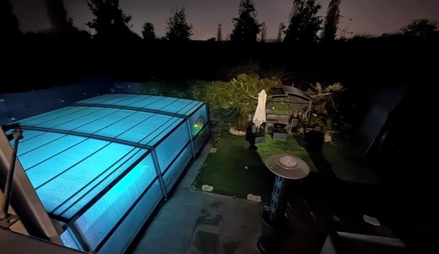 House with a pool and tropical garden