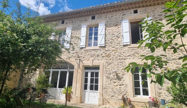 Stone mansion with a garden