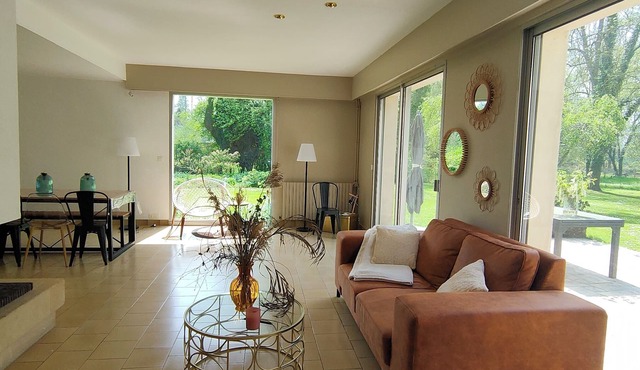 Waterfront home with a large, enclosed garden